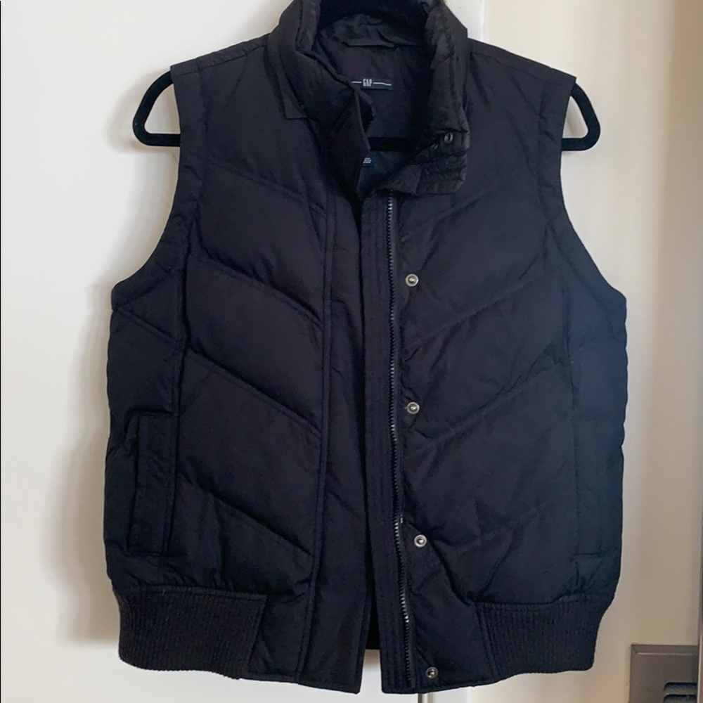 Down vest with chevron stitching and ribbed trim